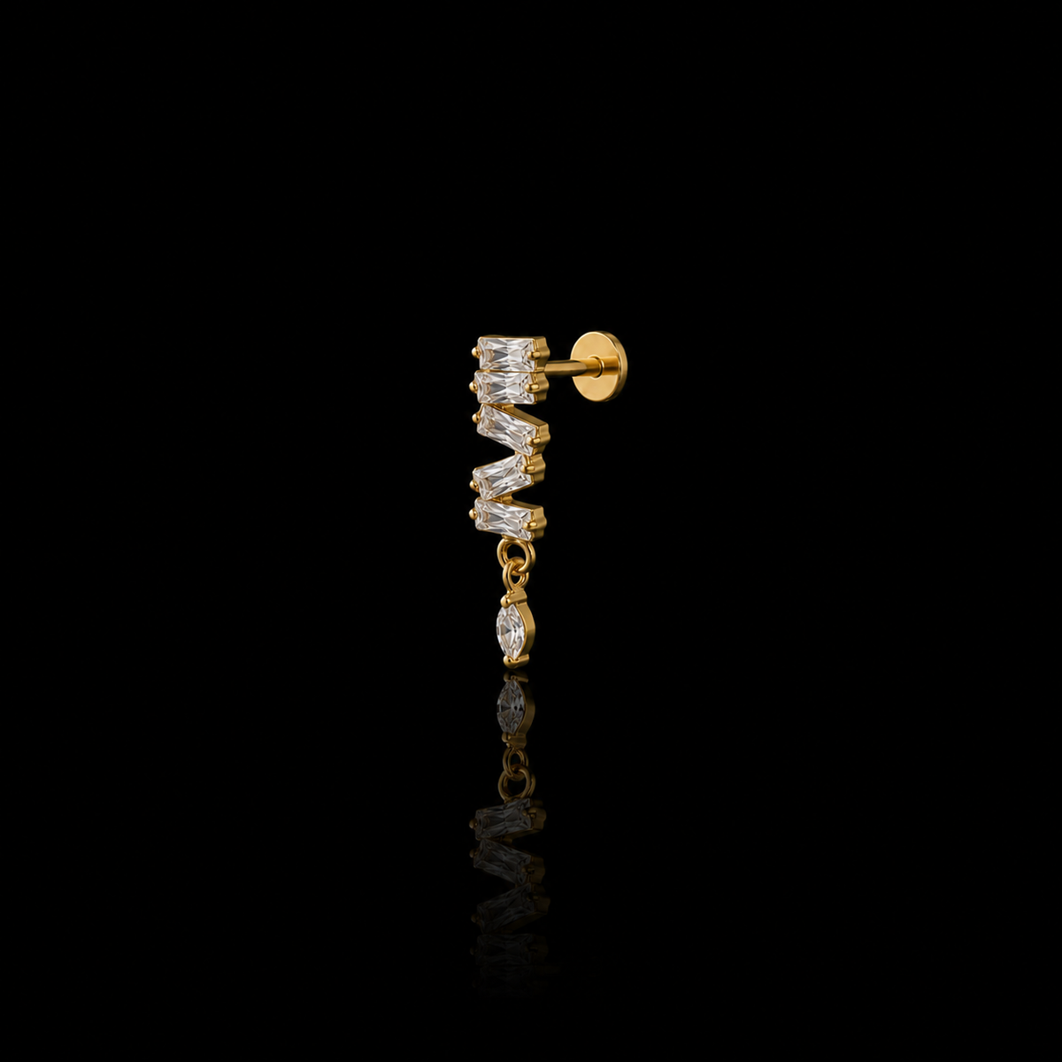 Cadence gold flat-back earring on a black reflective surface
