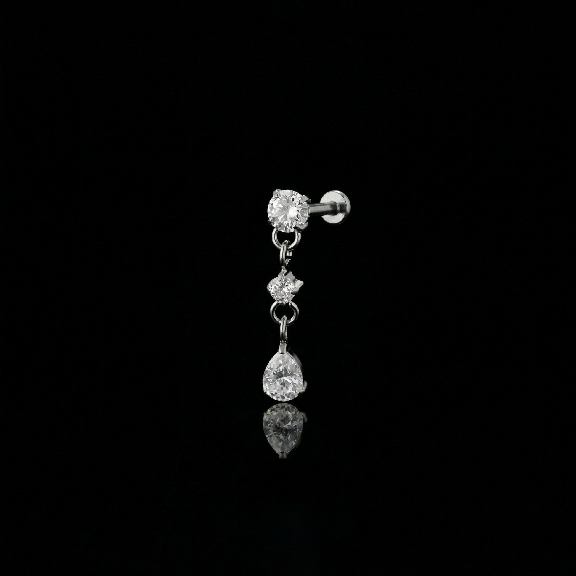 Cascade Bloom flat-back earring in titanium - ear closeup detail