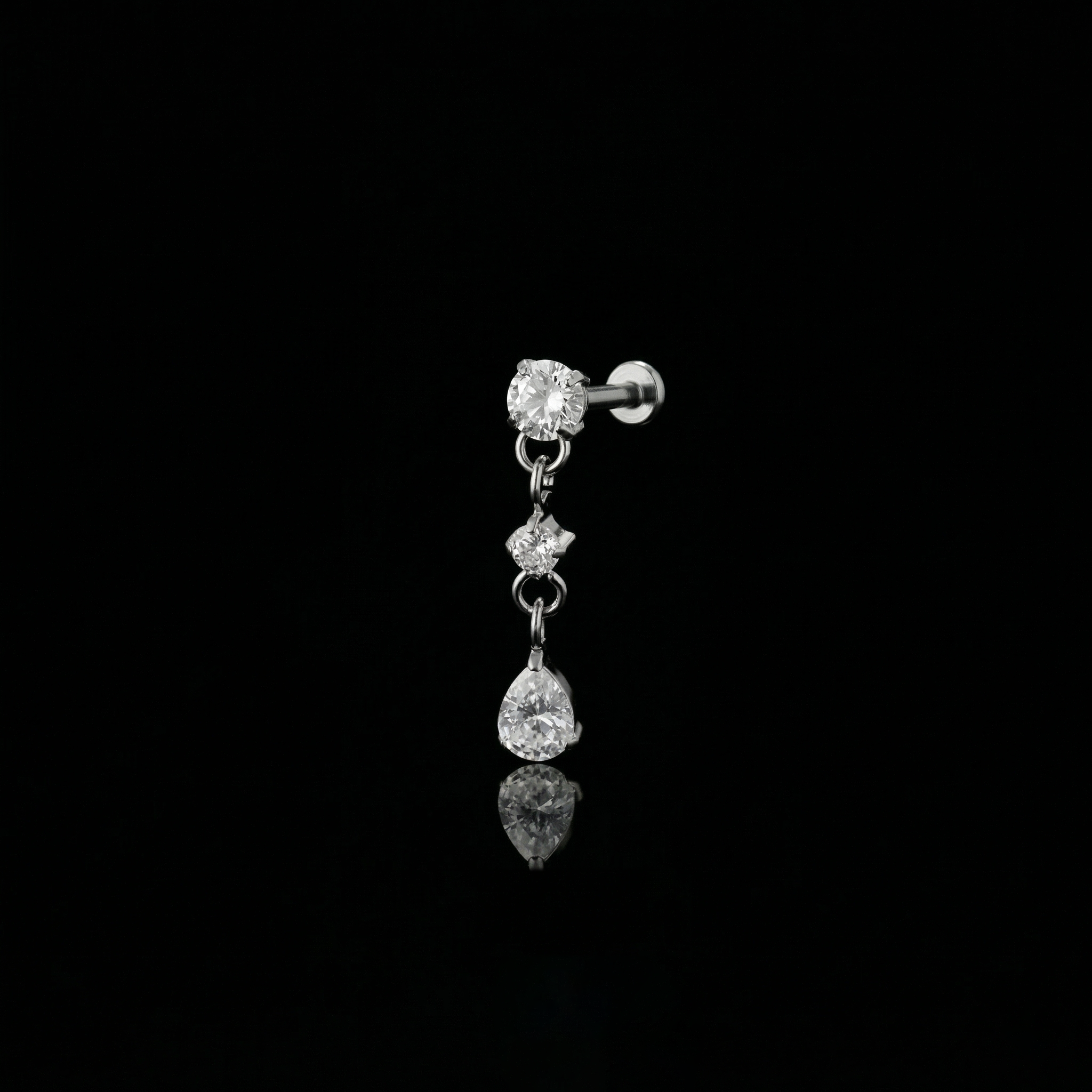 Cascade Bloom flat-back earring in titanium - ear closeup detail