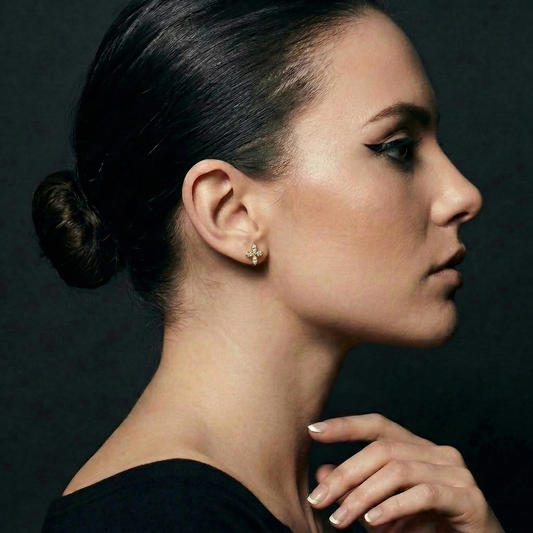 Clover Nova flat-back earring in gold - worn on model ear