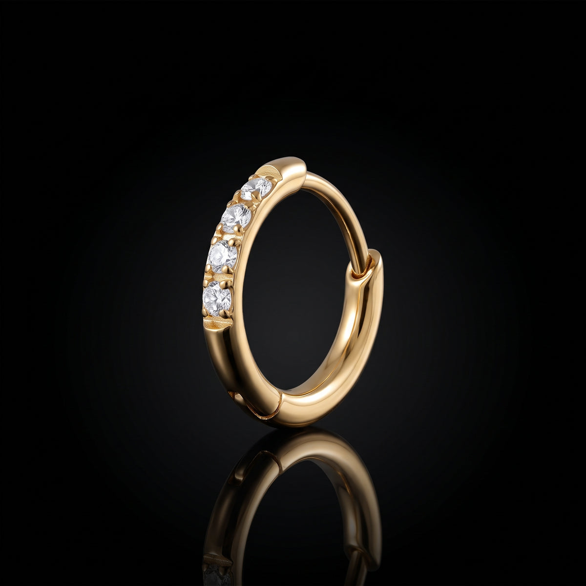 Halo 8mm gold hoop earring on a black reflective surface