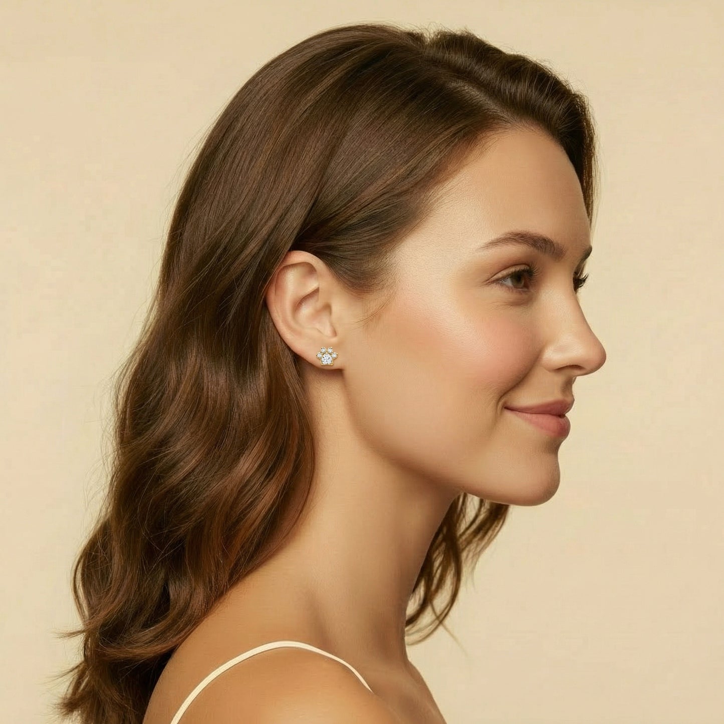 Paw Bloom flat-back earring in gold - worn on model ear