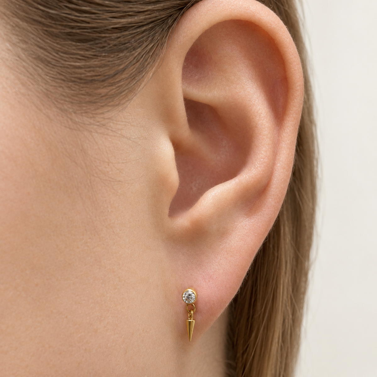 Prism Drop Bloom flat-back earring in gold - ear closeup detail